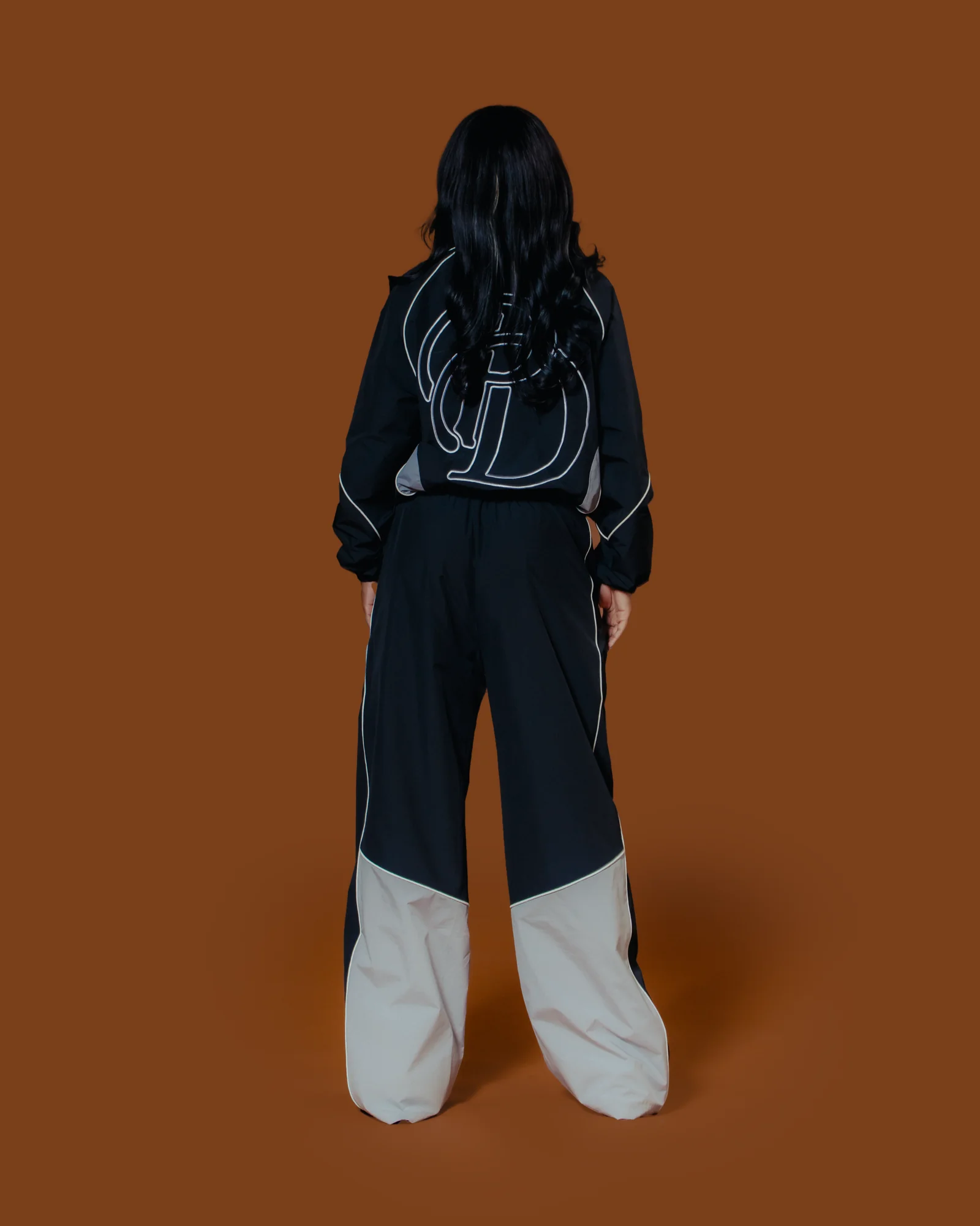 Black and grey Plaisir Dernier track set, monogram back