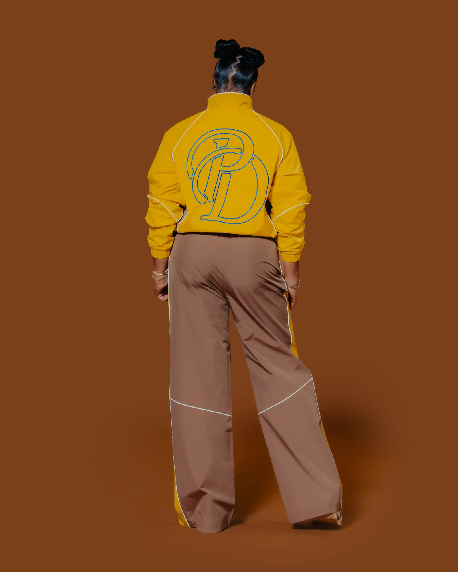 Yellow and brown Plaisir Dernier track set, back