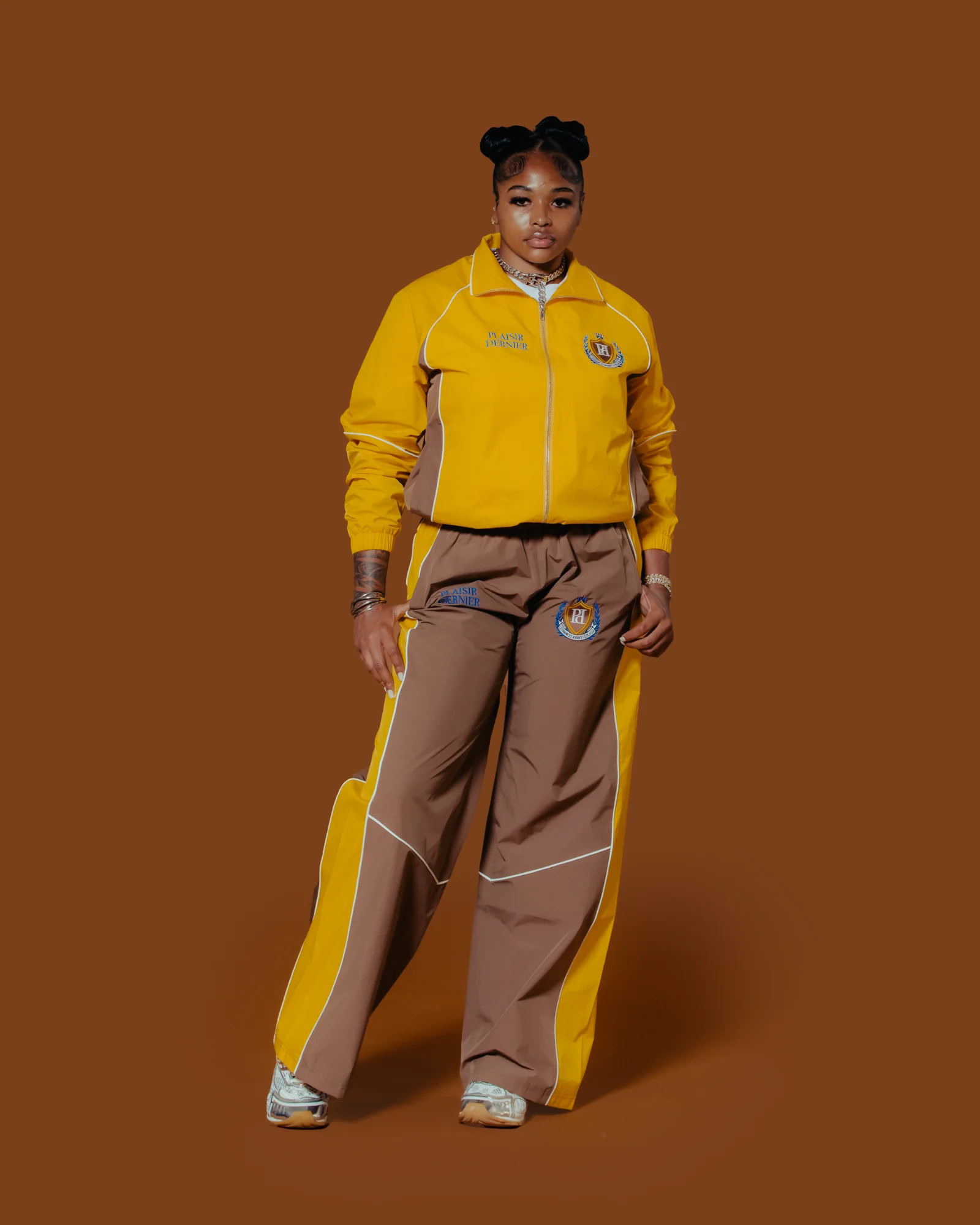 Yellow and brown Plaisir Dernier track set, front